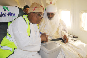 His Highness Alhaji Muhammad Sanusi II, The Emir of Kano (r) (on board Med-View Aircraft to Lagos) in a chat with Alhaji Muneer Bankole, Managing Director, Med-View Airline sfter a reception for Med-View Airline team by the Emir of Kano to felicitate with the Airline on its Lagos-Kano inaugural flight on Wednesday.