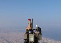 Emirates takes advertising to a new height as cabin crew stand on top Burg Khalifa
